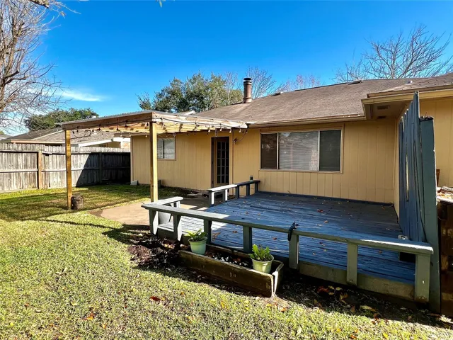 a front view of a house with a large window