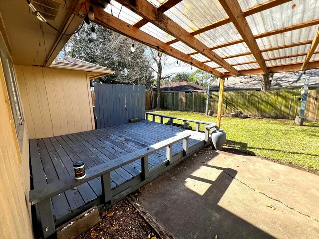 a view of a backyard with a patio