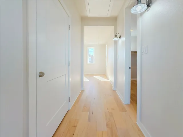 a view of a bathroom from a hallway