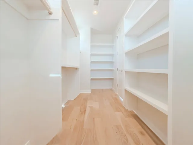 a view of a room with a wooden floor