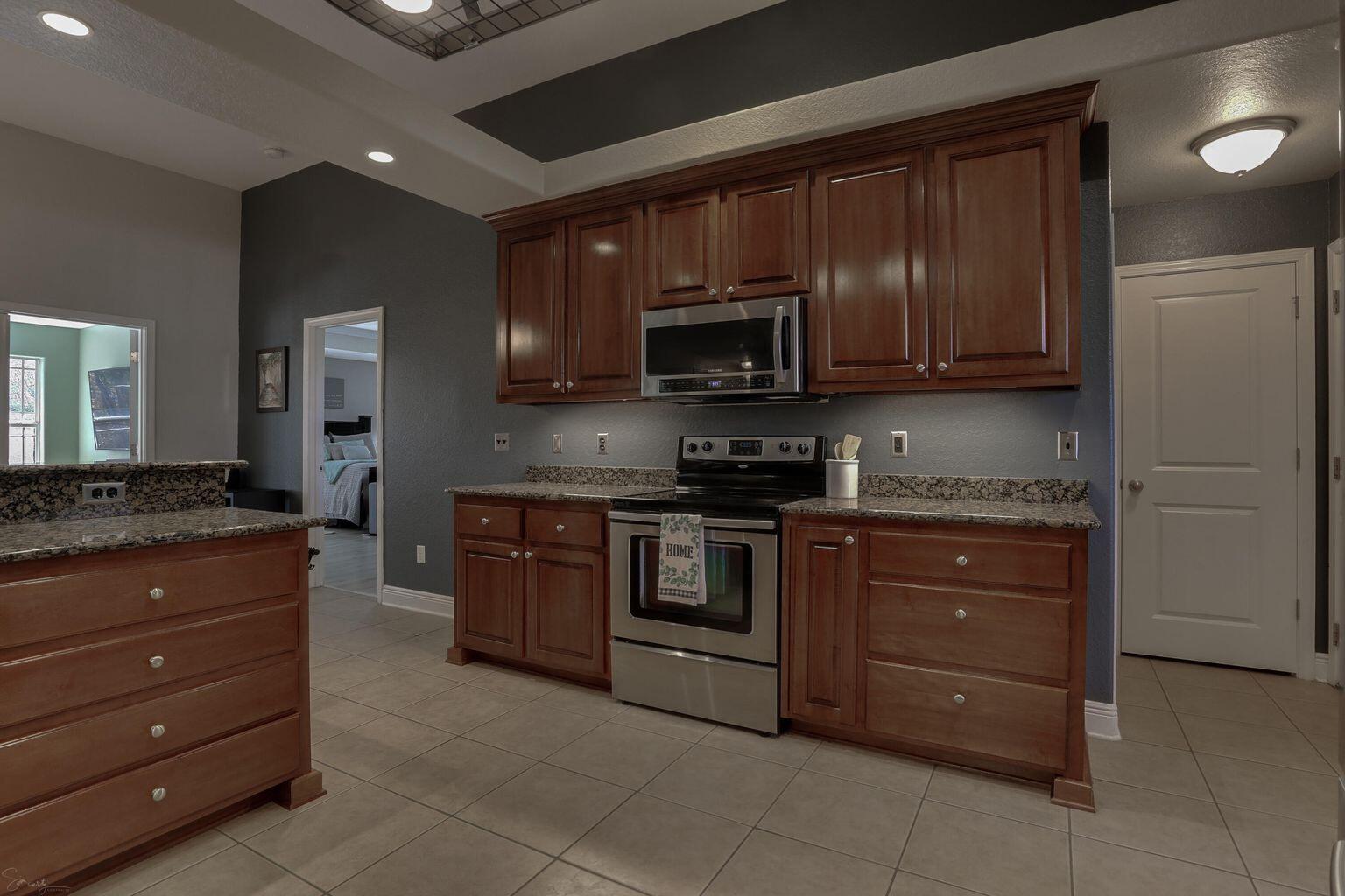 136 Leonine Hollow Crestview, FL 32536 - Photo 11 of 27 a kitchen with a sink and a stove top oven