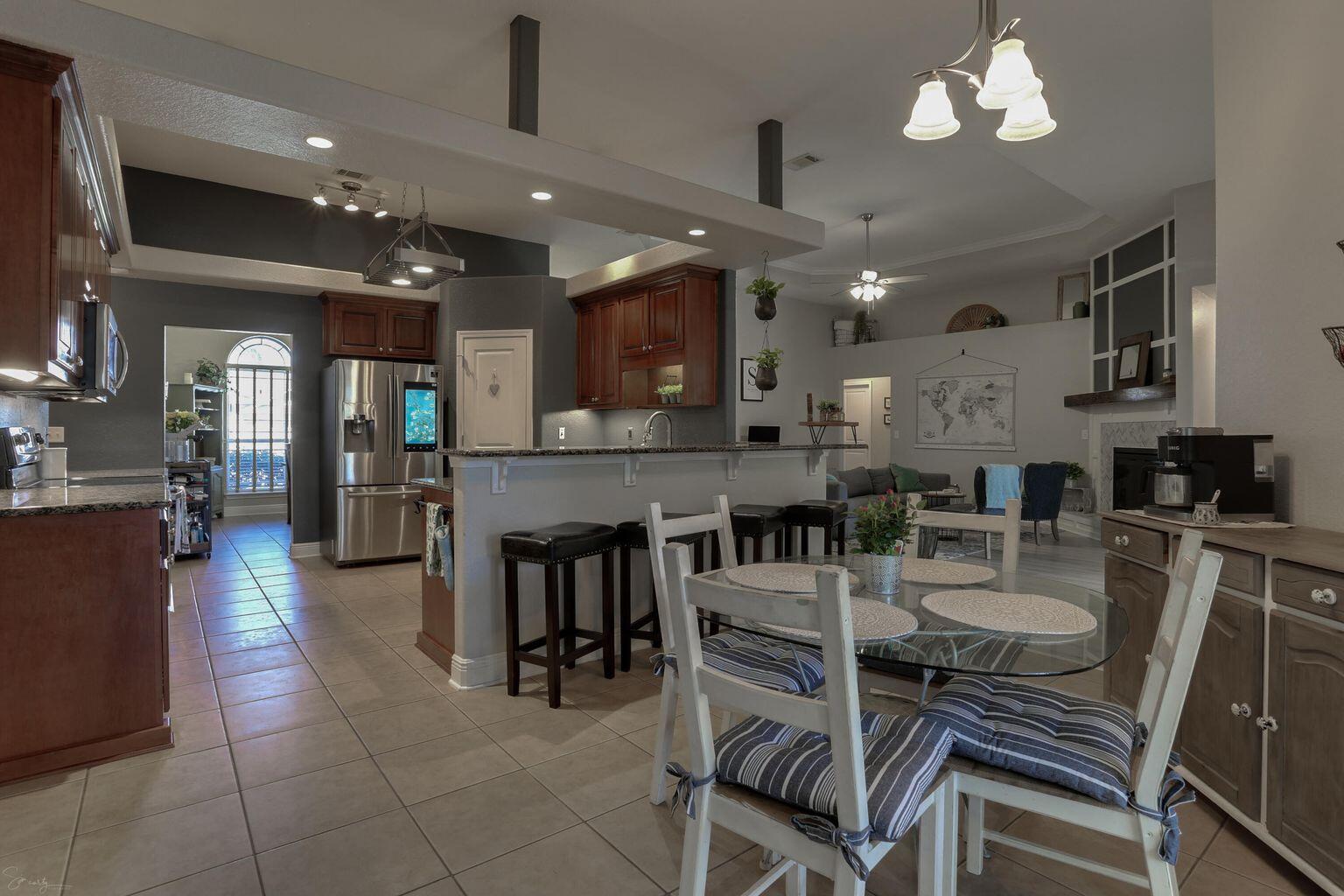 136 Leonine Hollow Crestview, FL 32536 - Photo 13 of 27 a large kitchen with a table and chairs