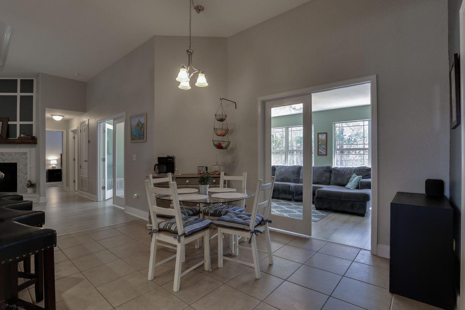 136 Leonine Hollow Crestview, FL 32536 - Photo 14 of 27 a view of a dining room with furniture and a chandelier
