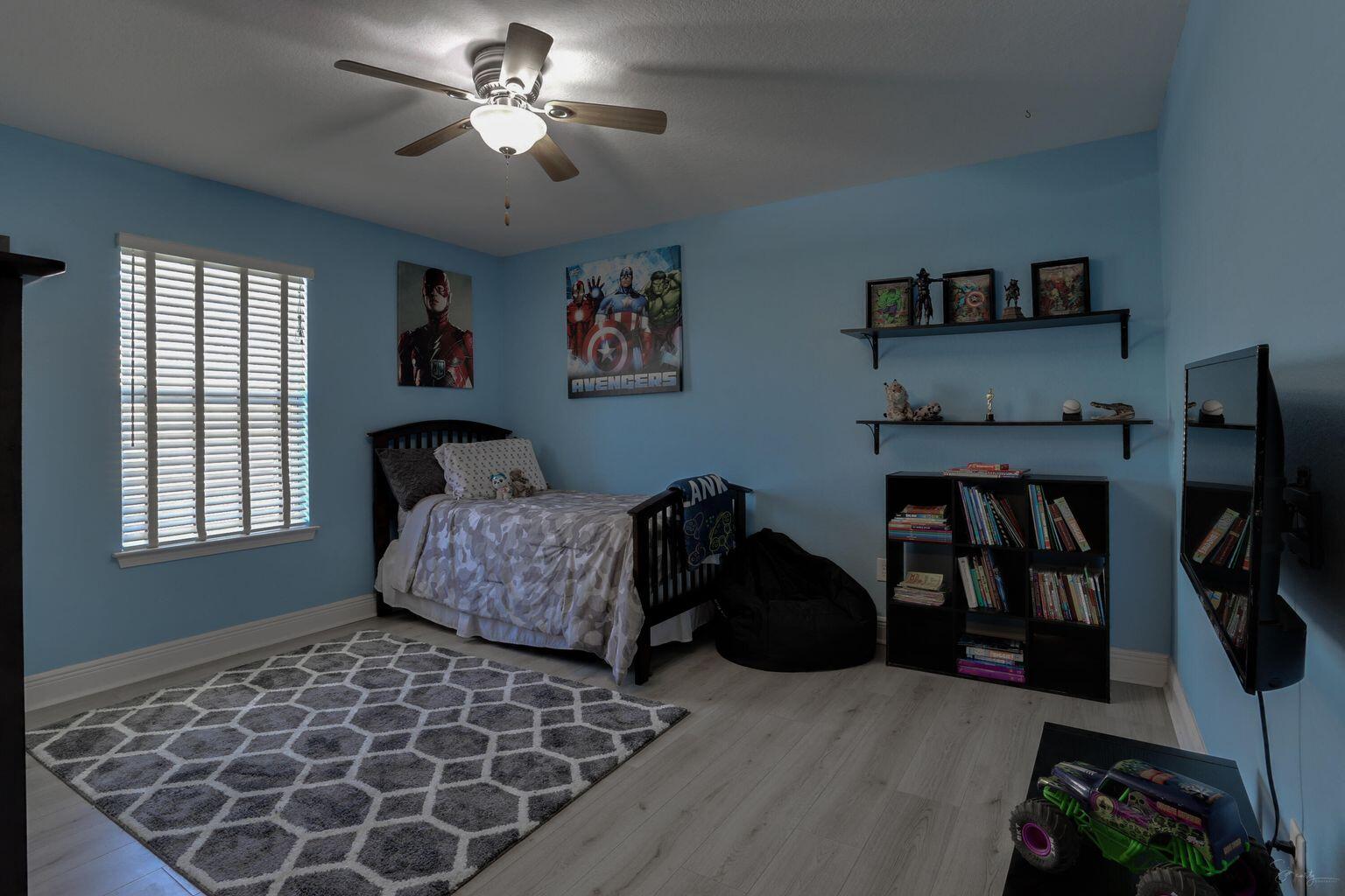 136 Leonine Hollow Crestview, FL 32536 - Photo 17 of 27 a bedroom with furniture and a window
