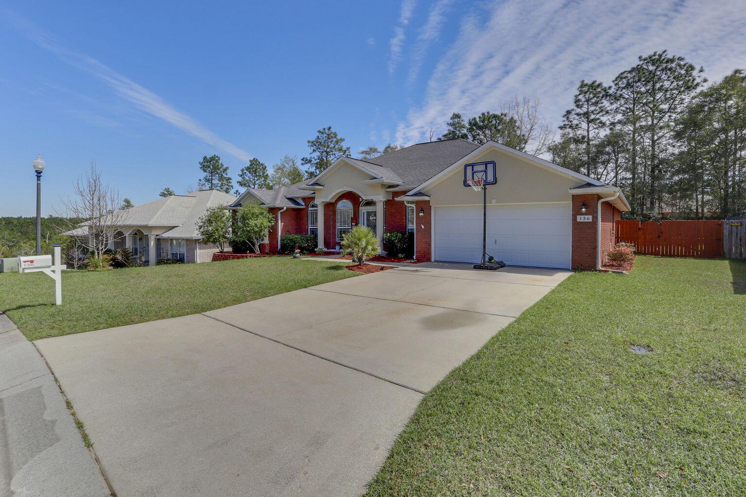 136 Leonine Hollow Crestview, FL 32536 - Photo 2 of 27 a front view of house with yard and green space