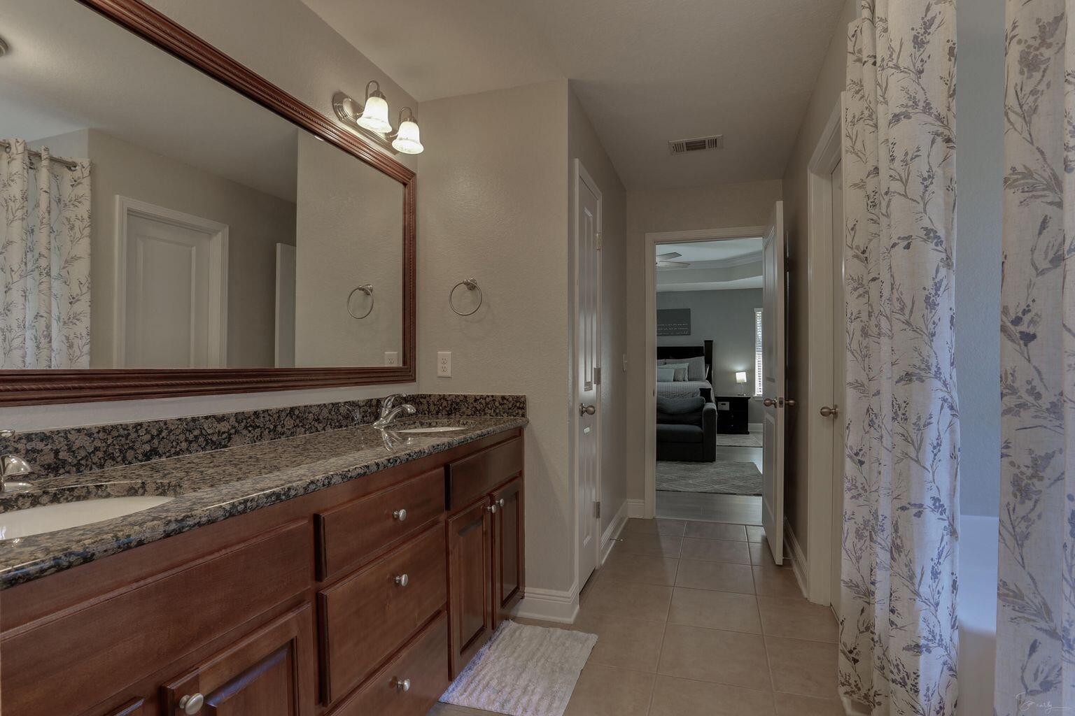 136 Leonine Hollow Crestview, FL 32536 - Photo 21 of 27 a bathroom with a sink and a mirror