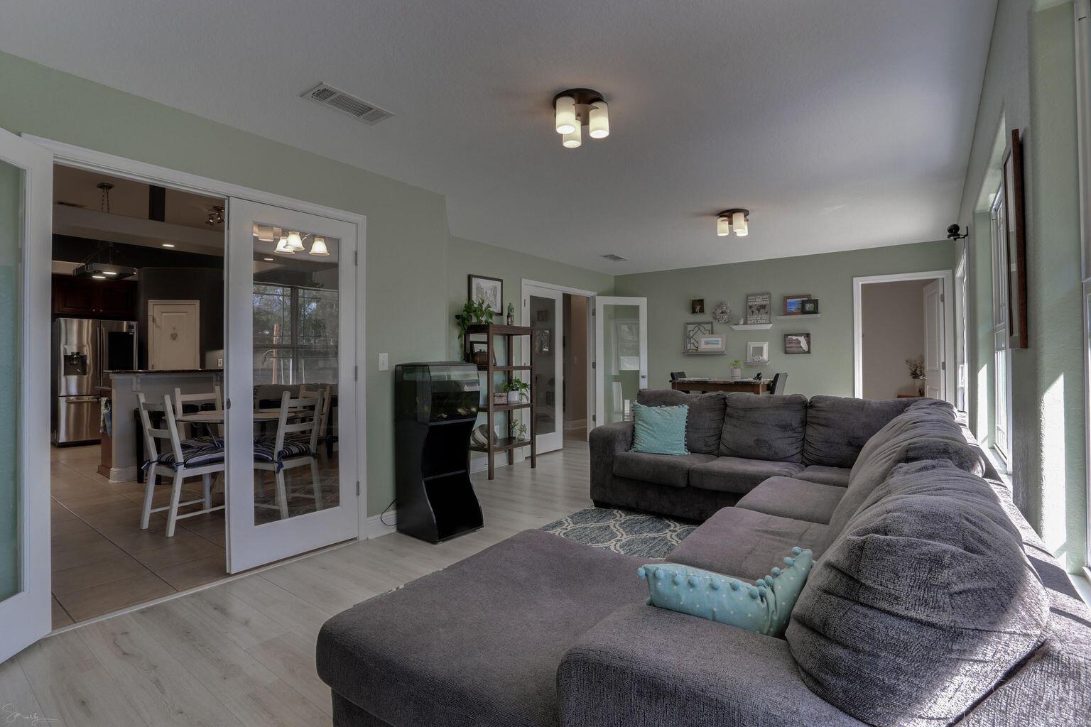 136 Leonine Hollow Crestview, FL 32536 - Photo 24 of 27 a living room with furniture and a view of kitchen