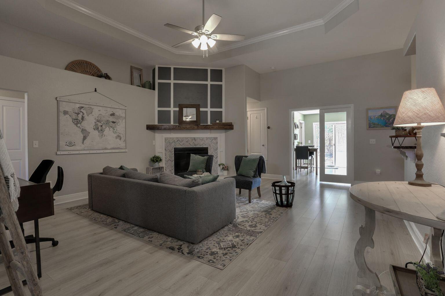 136 Leonine Hollow Crestview, FL 32536 - Photo 7 of 27 a living room with furniture and a fireplace