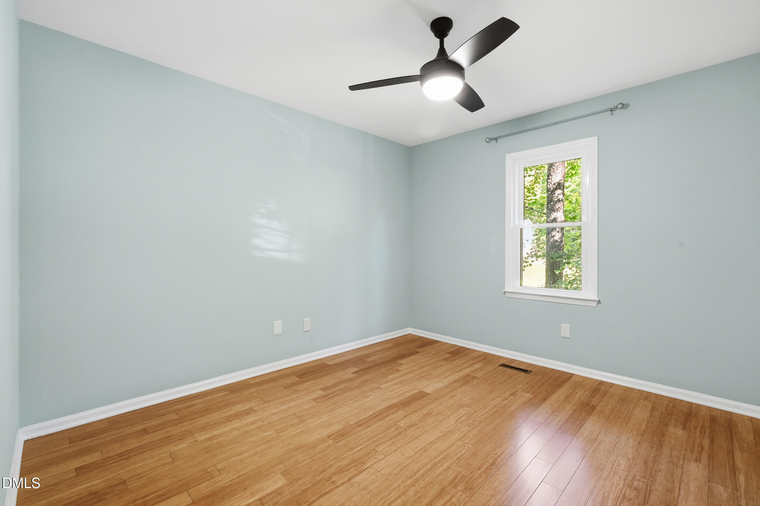 4 Little Spring Lane Durham, NC 27707 - Photo 16 of 34 a view of empty room with wooden floor and fan