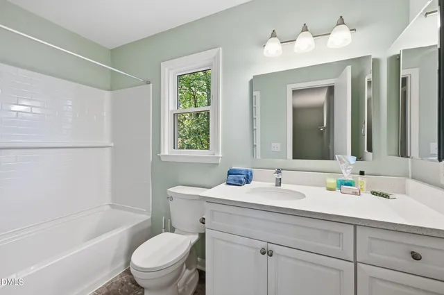 a bathroom with a sink toilet tub and shower