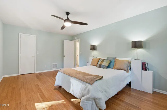 a bedroom with a bed and window