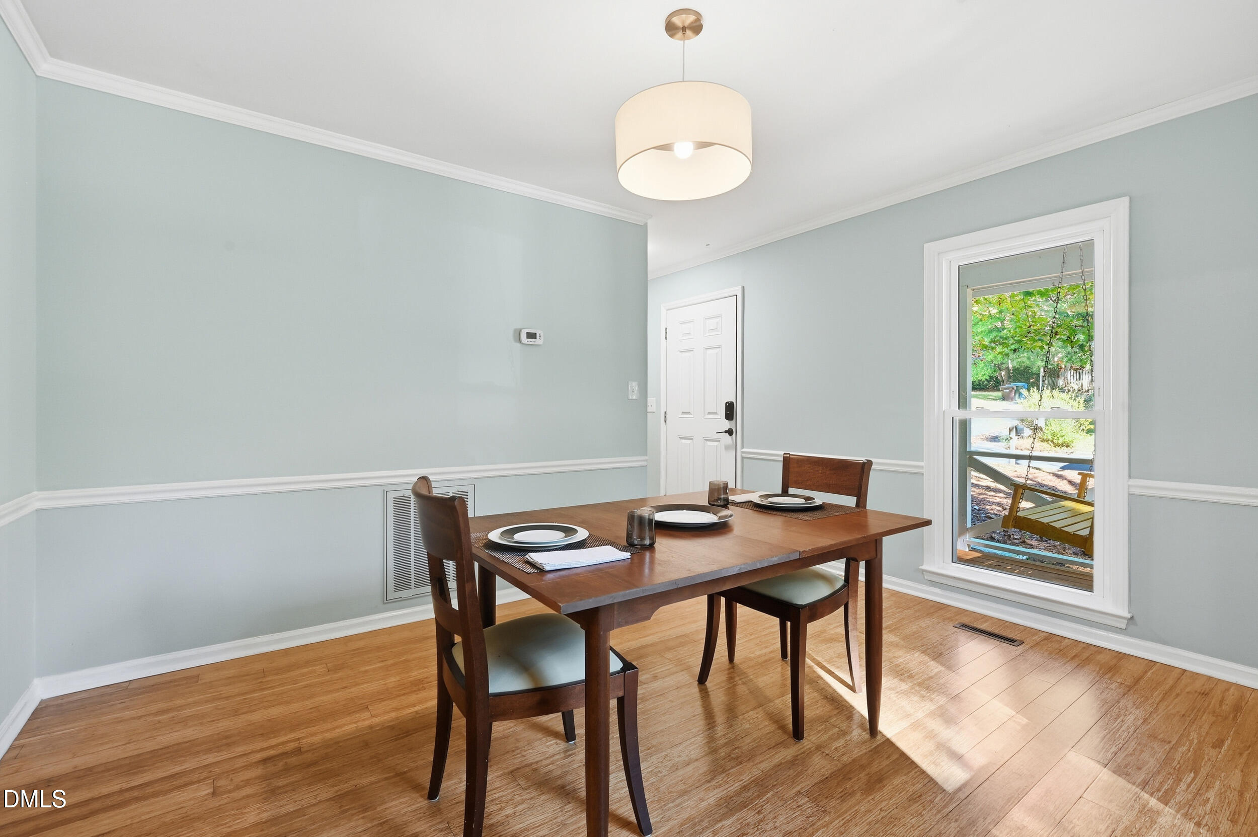 4 Little Spring Lane Durham, NC 27707 - Photo 9 of 34 a view of a dining room with furniture and wooden floor