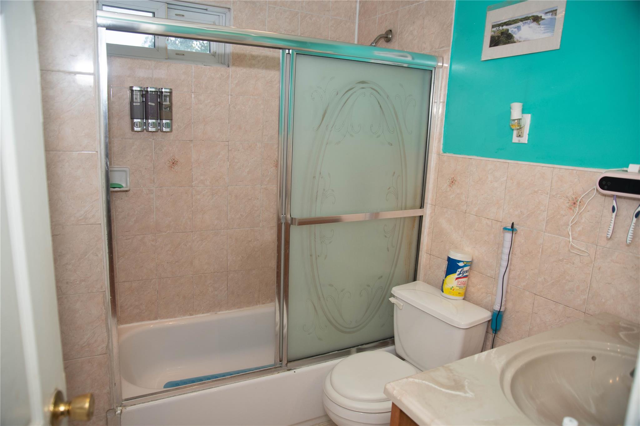 135-40 Alwick Road Queens, NY 11420 - Photo 13 of 38 a white toilet sitting next to a bath tub