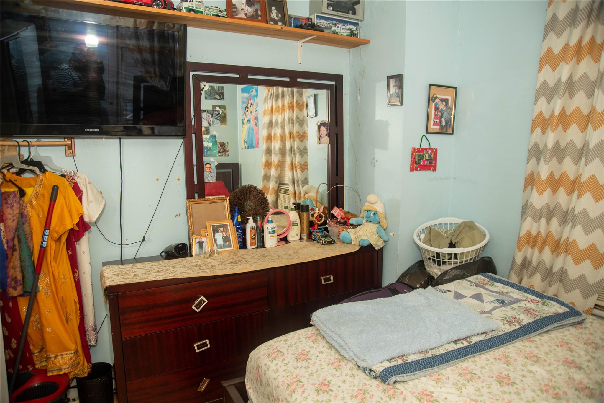 135-40 Alwick Road Queens, NY 11420 - Photo 16 of 38 a bathroom with a toilet sink and mirror