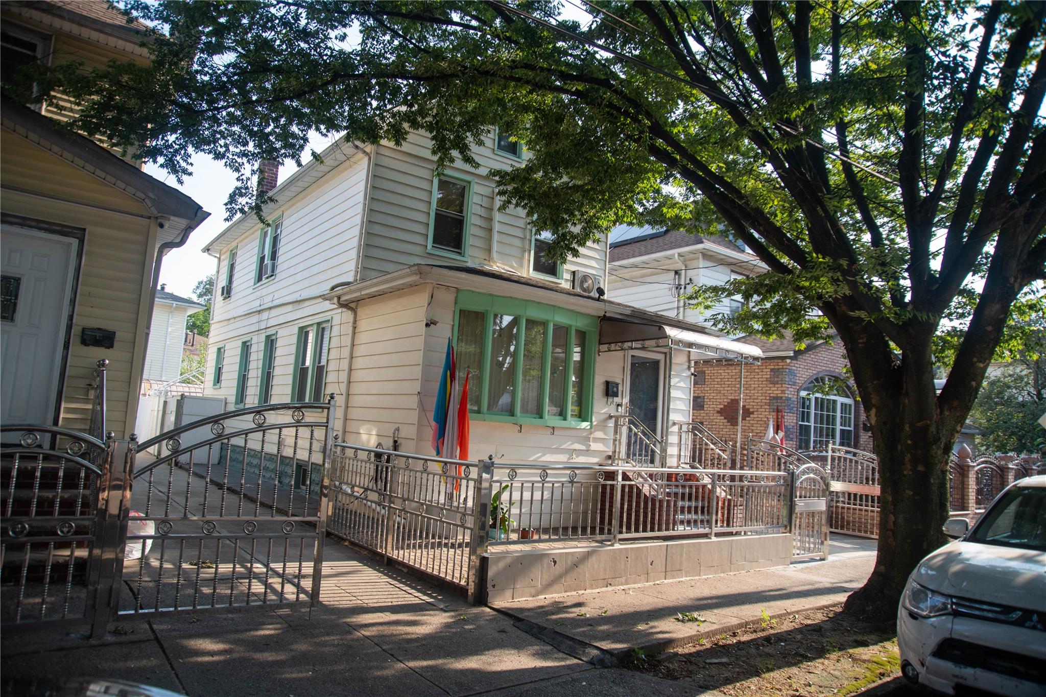 135-40 Alwick Road Queens, NY 11420 - Photo 2 of 38 a view of a patio with table and chairs and floor to ceiling window