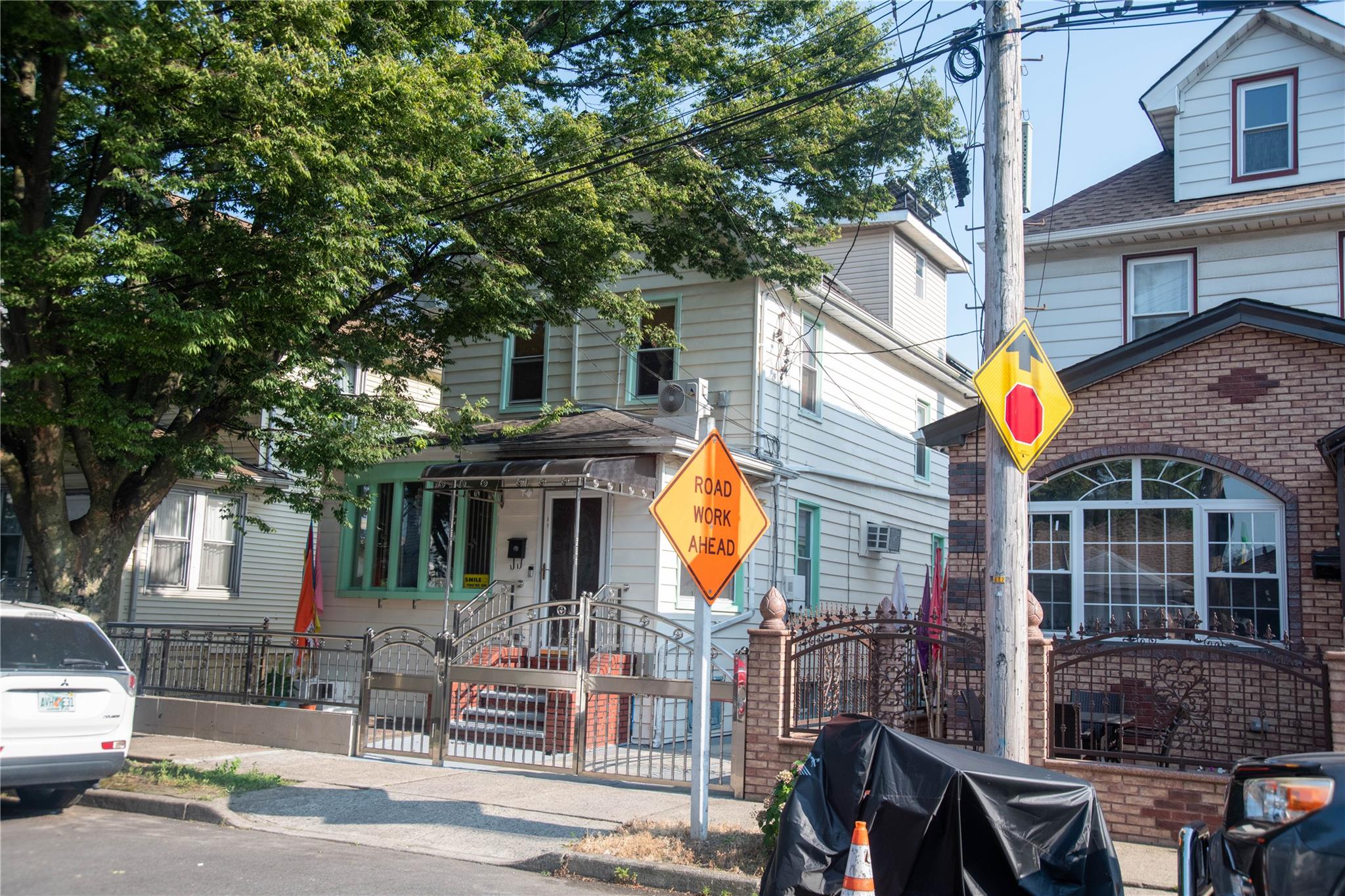 135-40 Alwick Road Queens, NY 11420 - Photo 3 of 38 a front view of a building with street