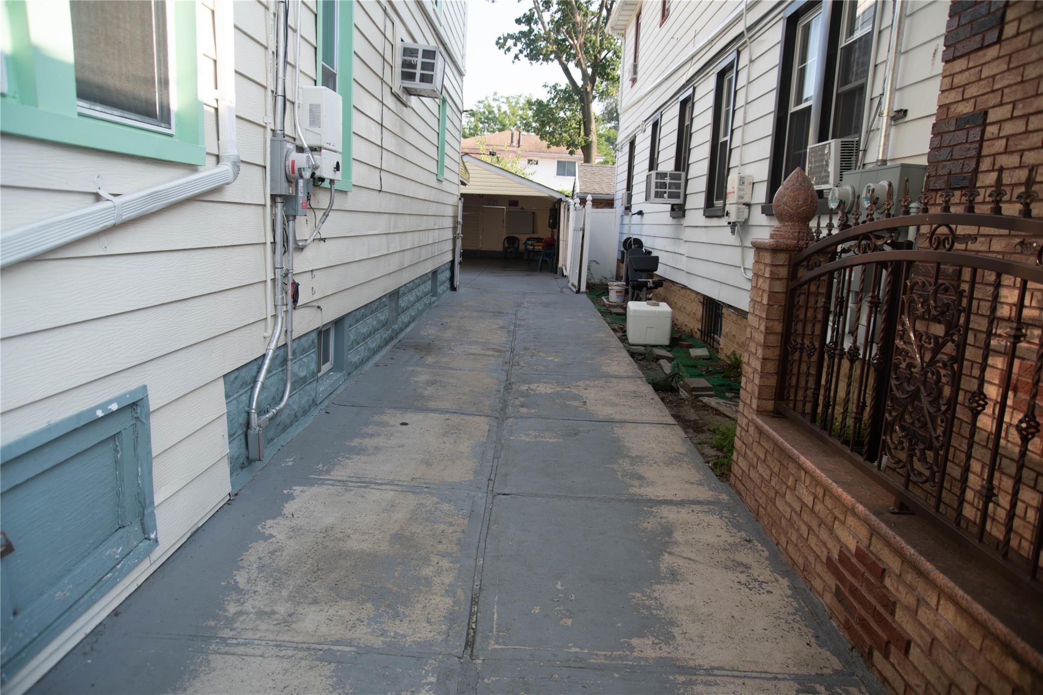 135-40 Alwick Road Queens, NY 11420 - Photo 35 of 38 a view of a pathway both side of building