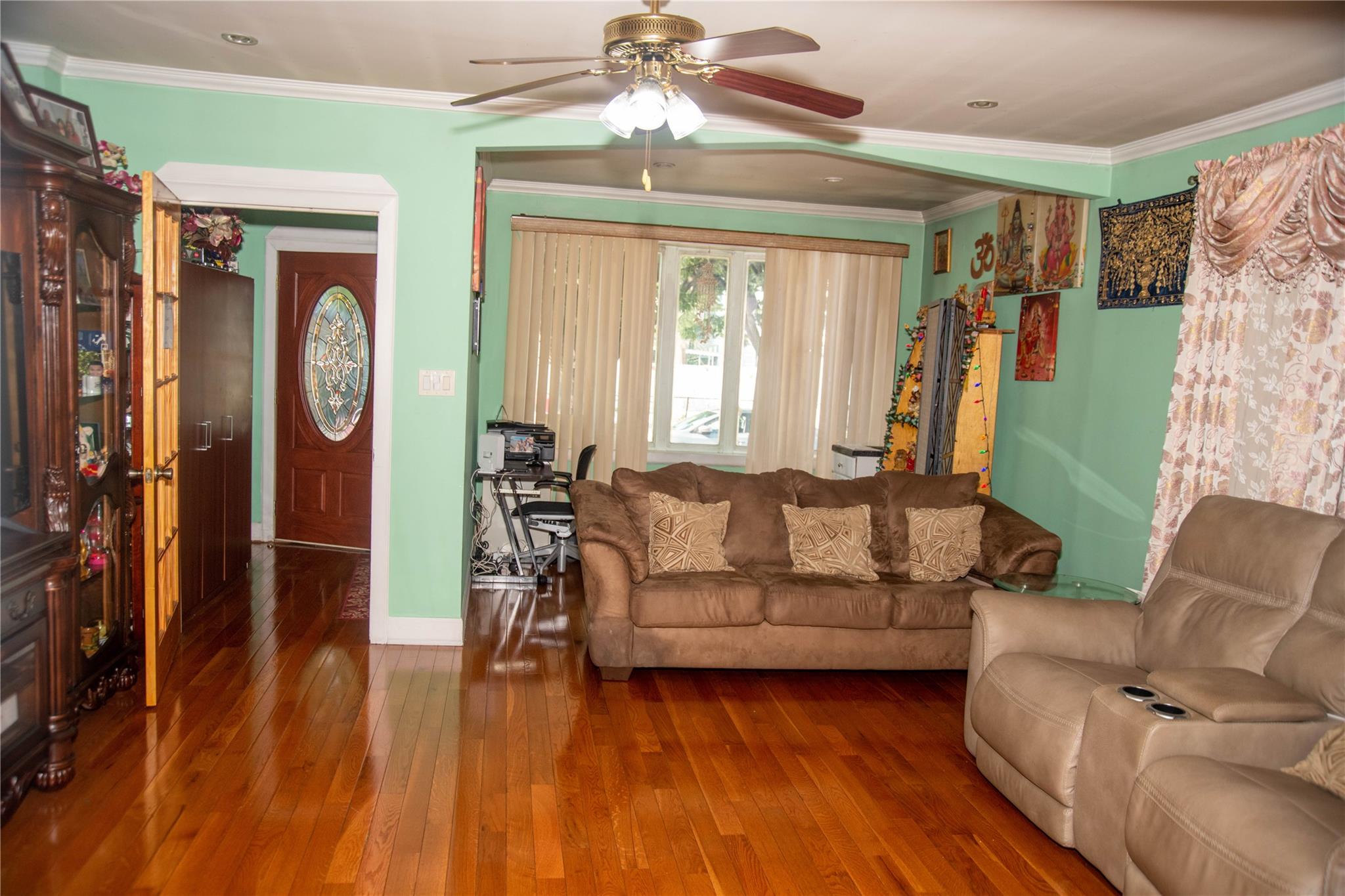 135-40 Alwick Road Queens, NY 11420 - Photo 4 of 38 a living room with furniture and a window