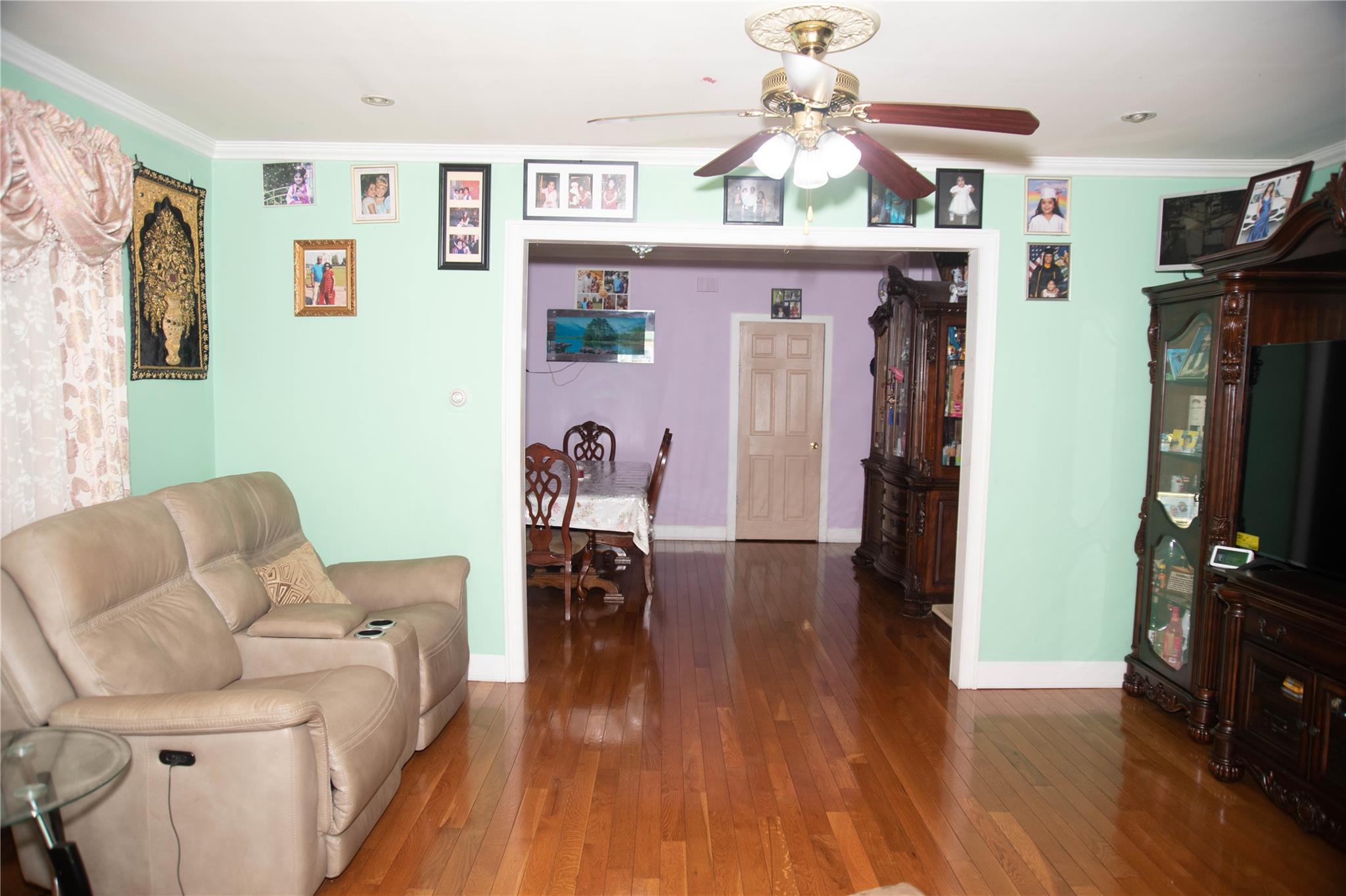 135-40 Alwick Road Queens, NY 11420 - Photo 7 of 38 a living room with furniture and a flat screen tv