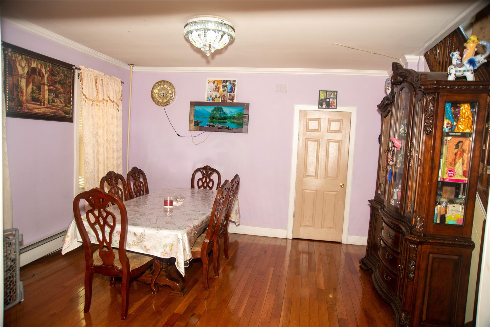 135-40 Alwick Road Queens, NY 11420 - Photo 8 of 38 a view of a dining room with furniture and wooden floor