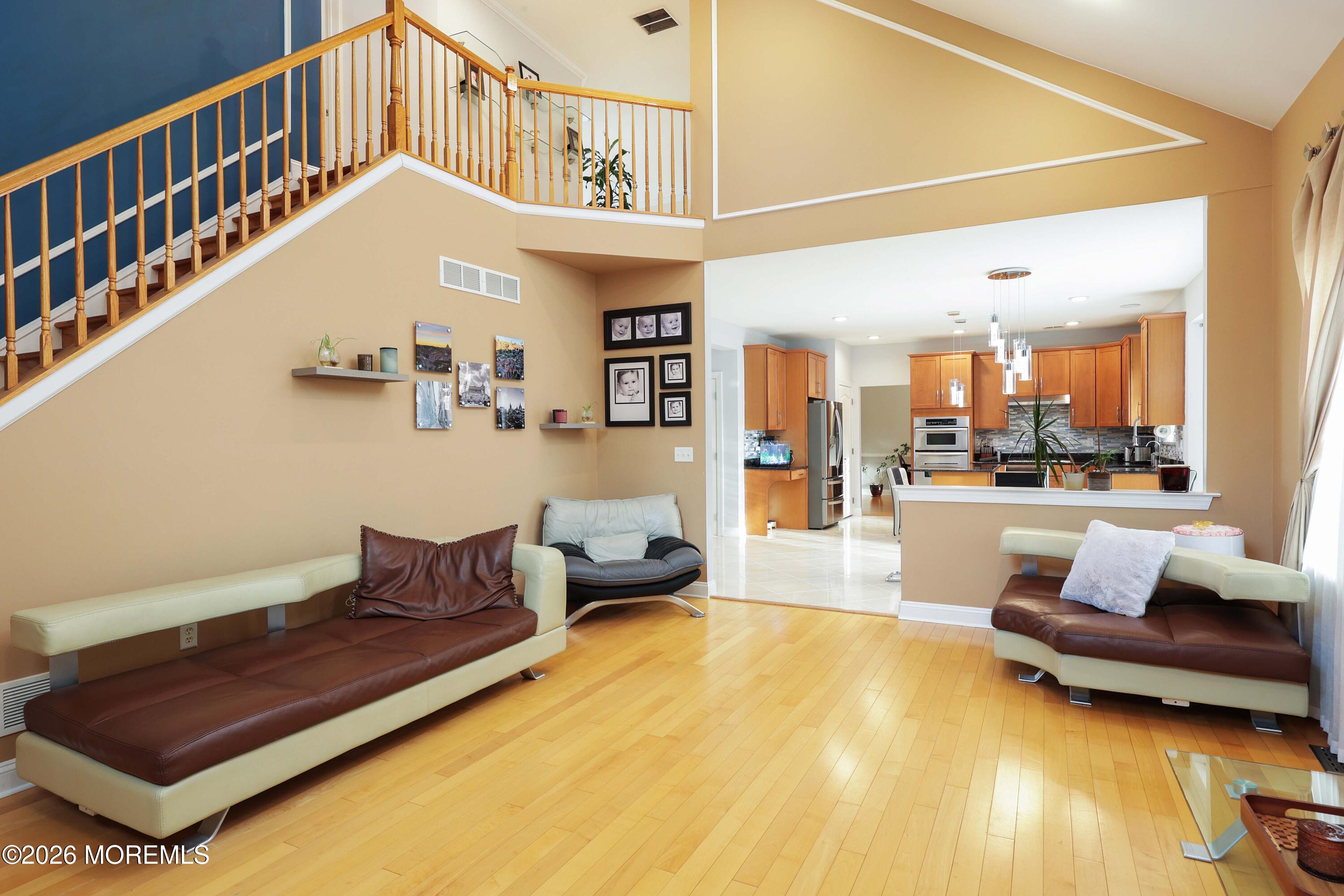14 Emily Road Manalapan, NJ 07726 - Photo 13 of 44 a living room with furniture and a table