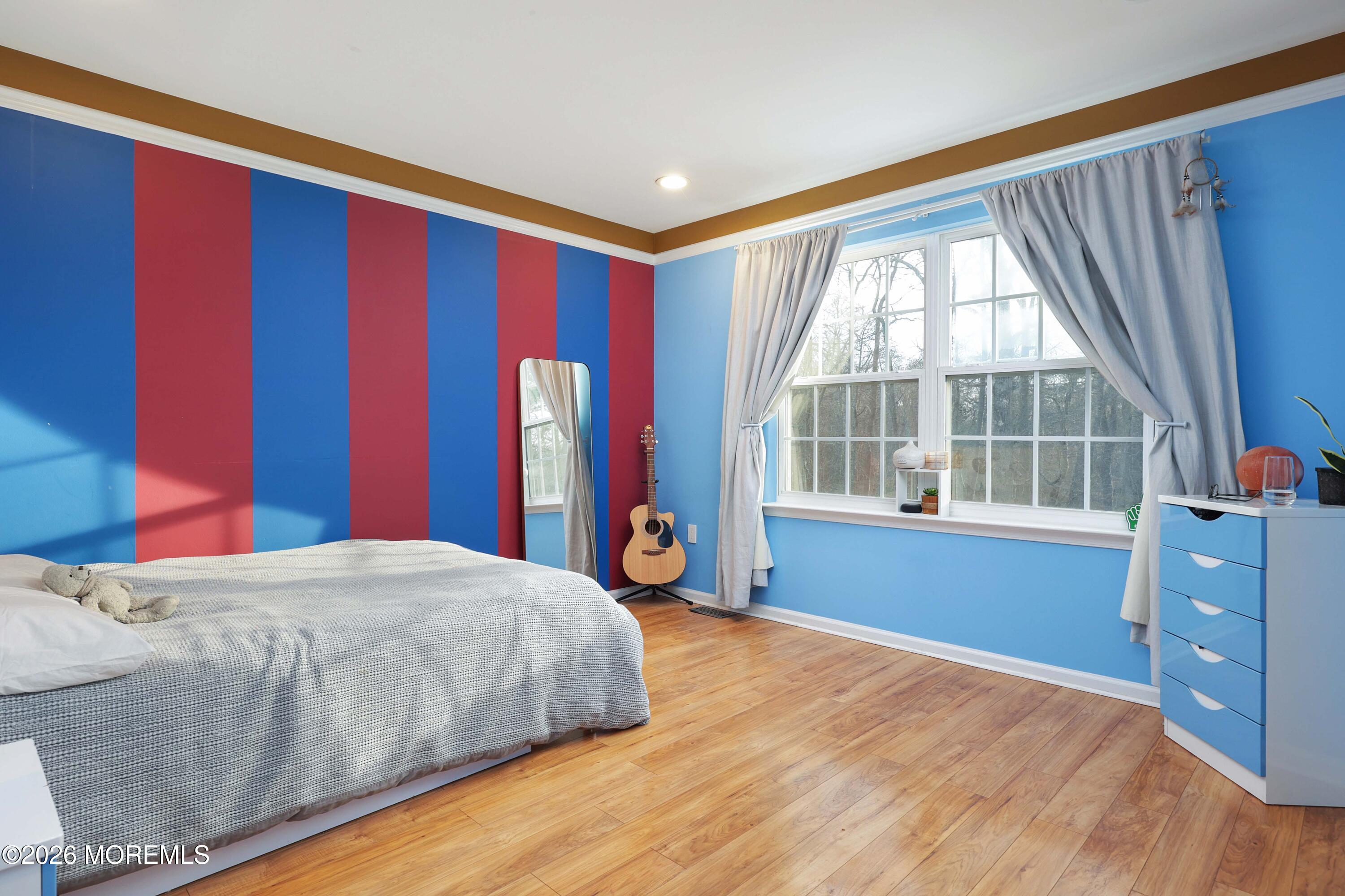 14 Emily Road Manalapan, NJ 07726 - Photo 17 of 44 a bedroom with a large bed and a large window