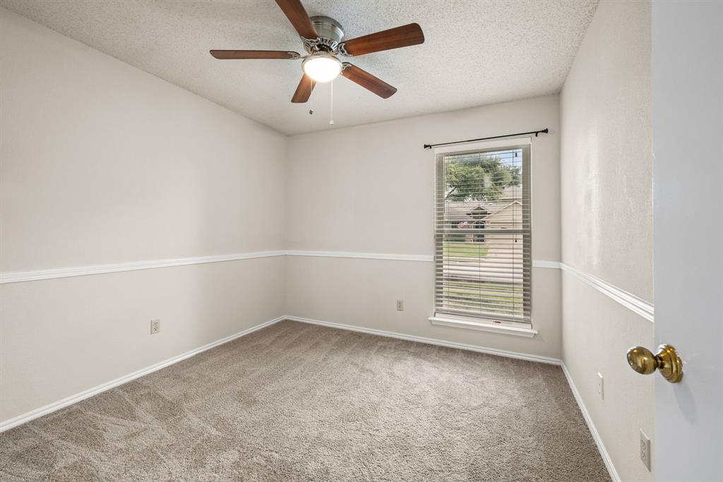 6605 Bluebonnet Drive Rowlett, TX 75089 - Photo 16 of 25 an empty room with windows and fan