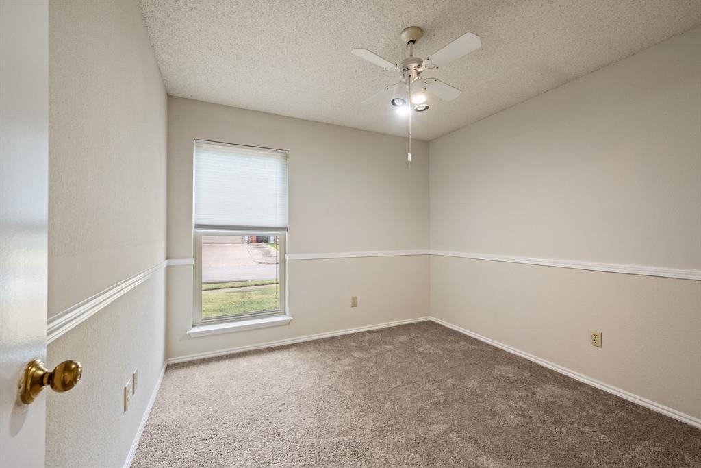 6605 Bluebonnet Drive Rowlett, TX 75089 - Photo 19 of 25 an empty room with windows and fan
