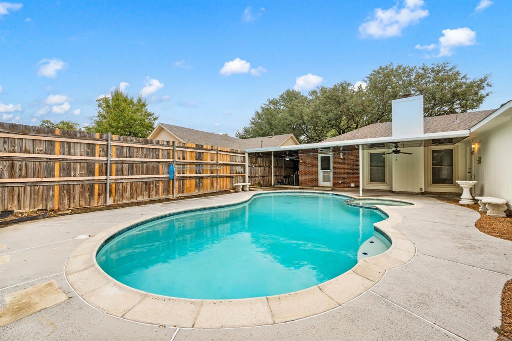 6605 Bluebonnet Drive Rowlett, TX 75089 - Photo 23 of 25 a view of a house with swimming pool and sitting area
