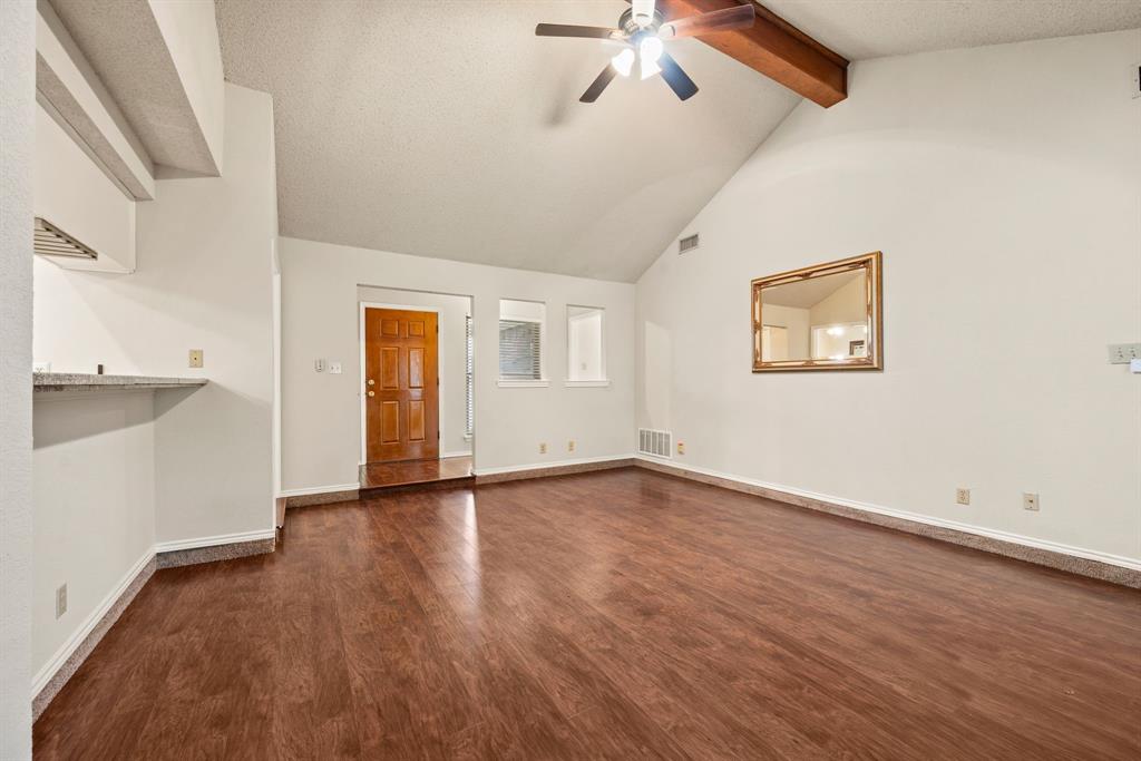 6605 Bluebonnet Drive Rowlett, TX 75089 - Photo 3 of 25 an empty room with wooden floor and windows