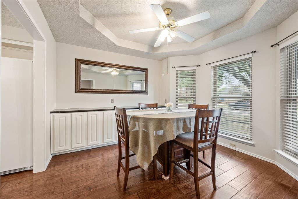 6605 Bluebonnet Drive Rowlett, TX 75089 - Photo 6 of 25 a view of a dining room with furniture window and wooden floor