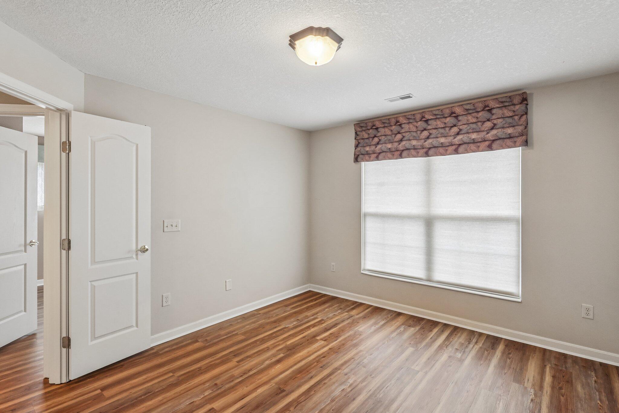 876 Flint Ridge Newport, KY 41076 - Photo 34 of 43 Room featuring wood-finish flooring, neutral wall tones, and white trim