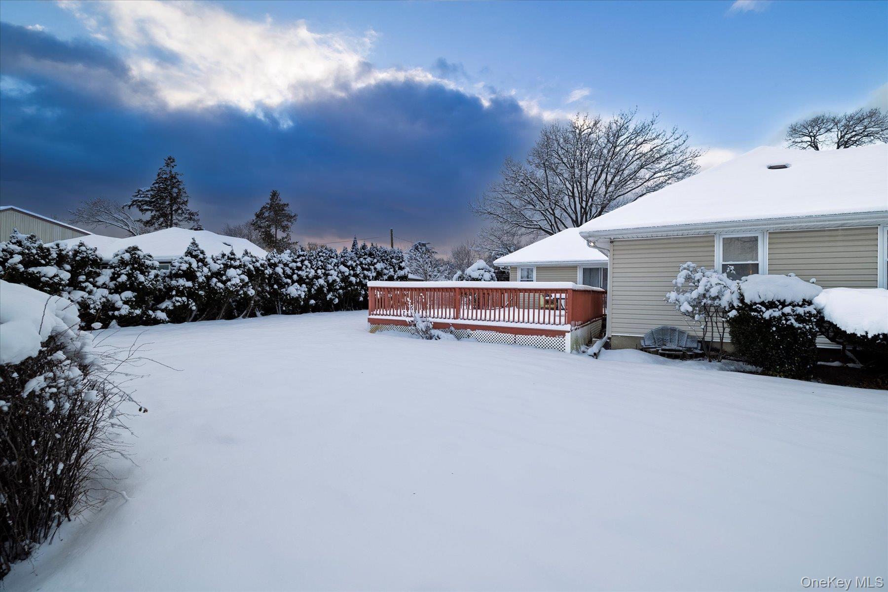 2934 Kinloch Road Wantagh, NY 11793 - Photo 25 of 30 Snowy yard featuring a deck