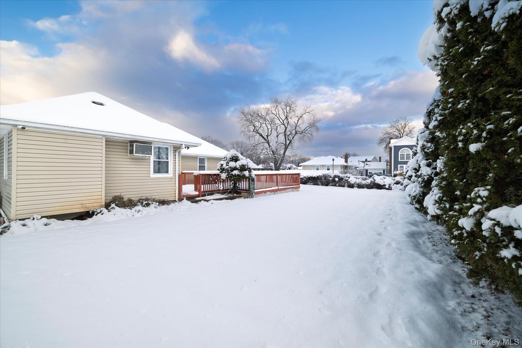2934 Kinloch Road Wantagh, NY 11793 - Photo 27 of 30 Snowy yard with a wooden deck