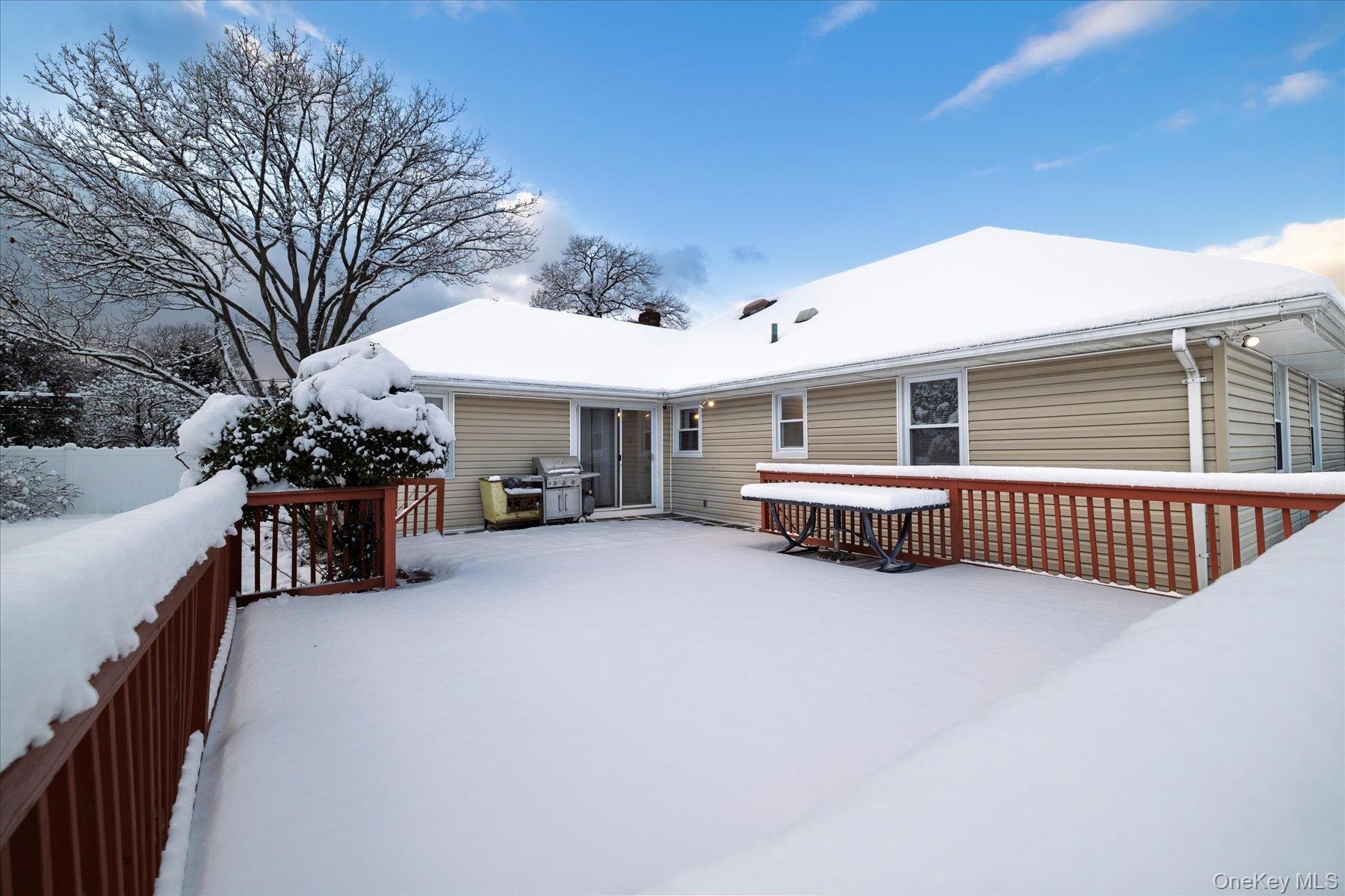 2934 Kinloch Road Wantagh, NY 11793 - Photo 29 of 30 Snow covered back of property featuring a deck