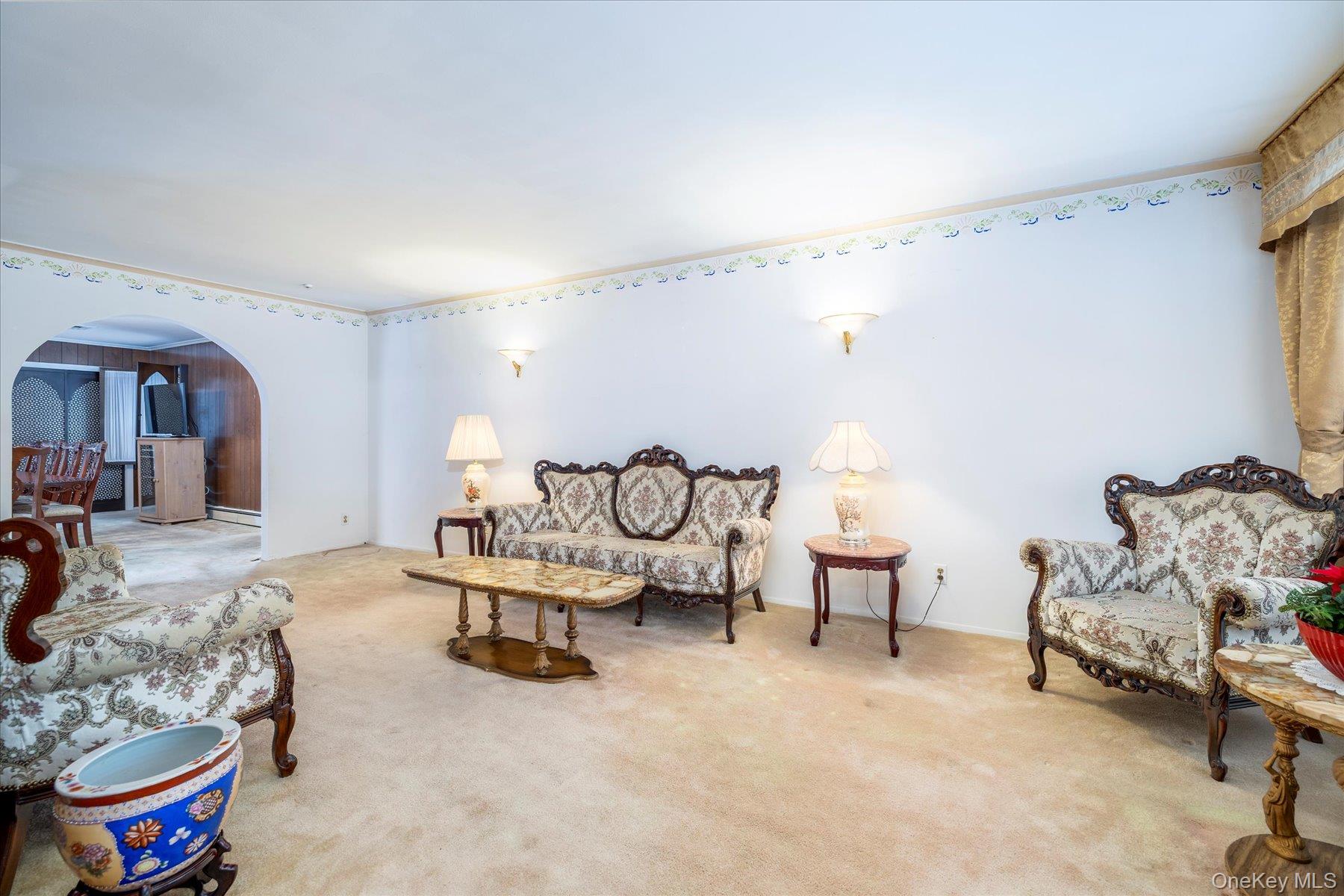2934 Kinloch Road Wantagh, NY 11793 - Photo 6 of 30 Living room with arched walkways, carpet