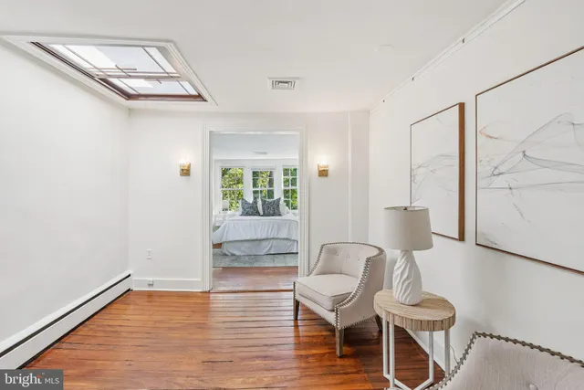 a view of a livingroom with furniture and wooden floor