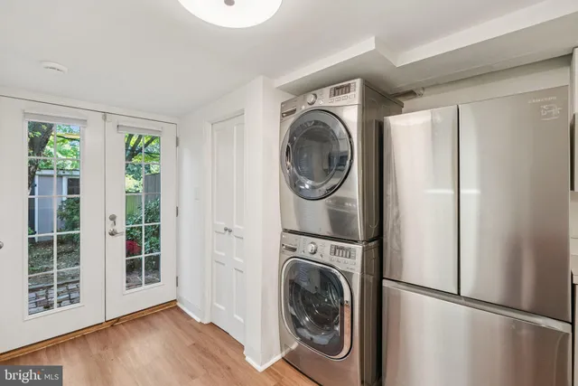 a view of a hallway with washer and dryer