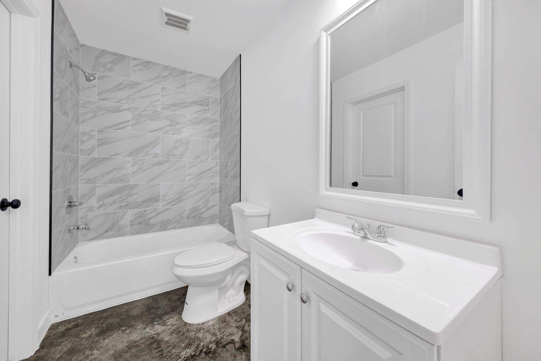 653 Gilleas Road Memphis, TN 38109 - Photo 20 of 24 a bathroom with a sink toilet and shower