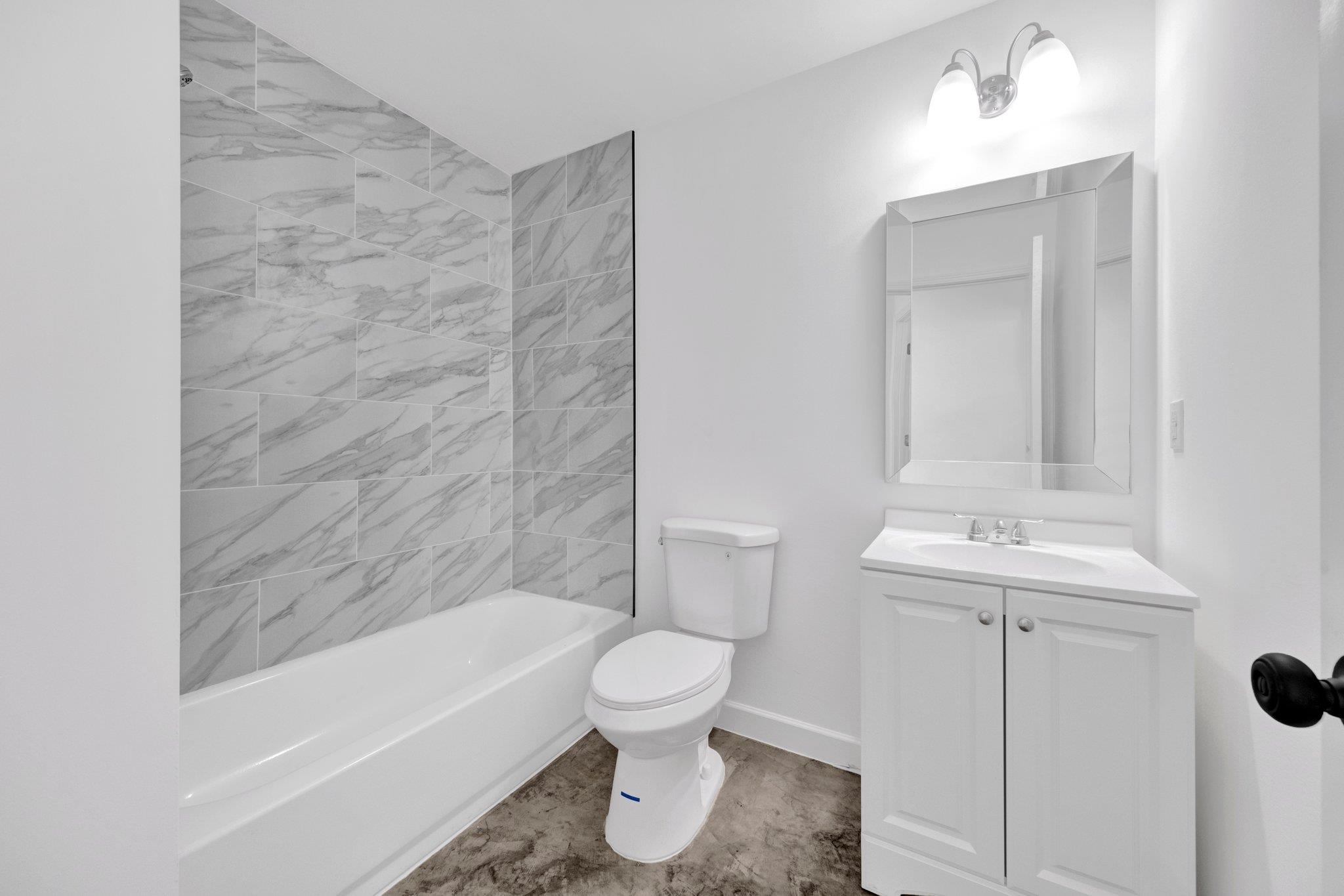 653 Gilleas Road Memphis, TN 38109 - Photo 24 of 24 a bathroom with a sink a toilet and shower