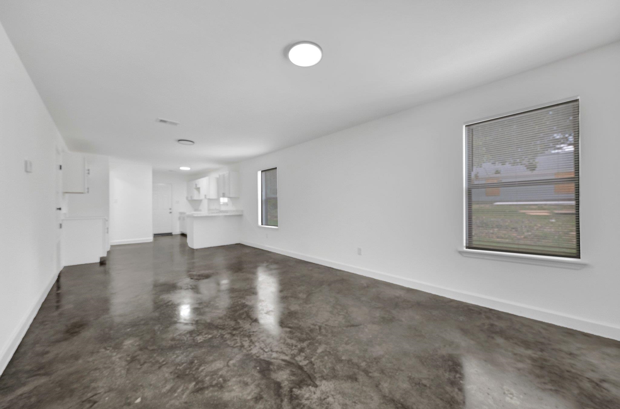 653 Gilleas Road Memphis, TN 38109 - Photo 8 of 24 a view of empty room with wooden floor