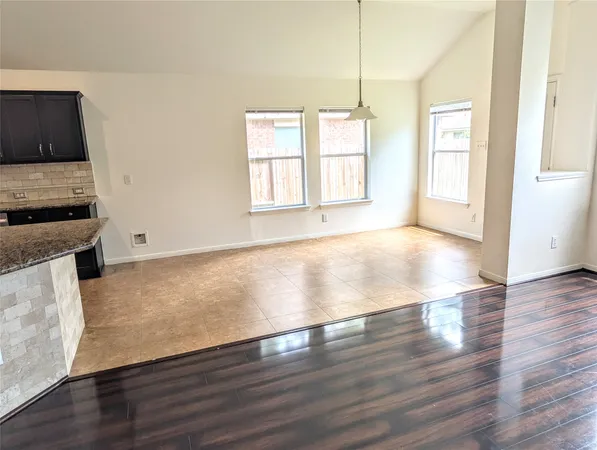 a view of room with window and ceiling fan