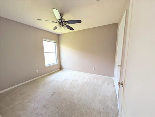 a view of a big room with carpet