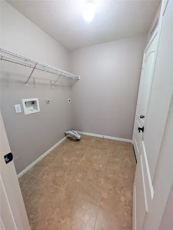 a large kitchen with stainless steel appliances granite countertop a stove and a wooden floors