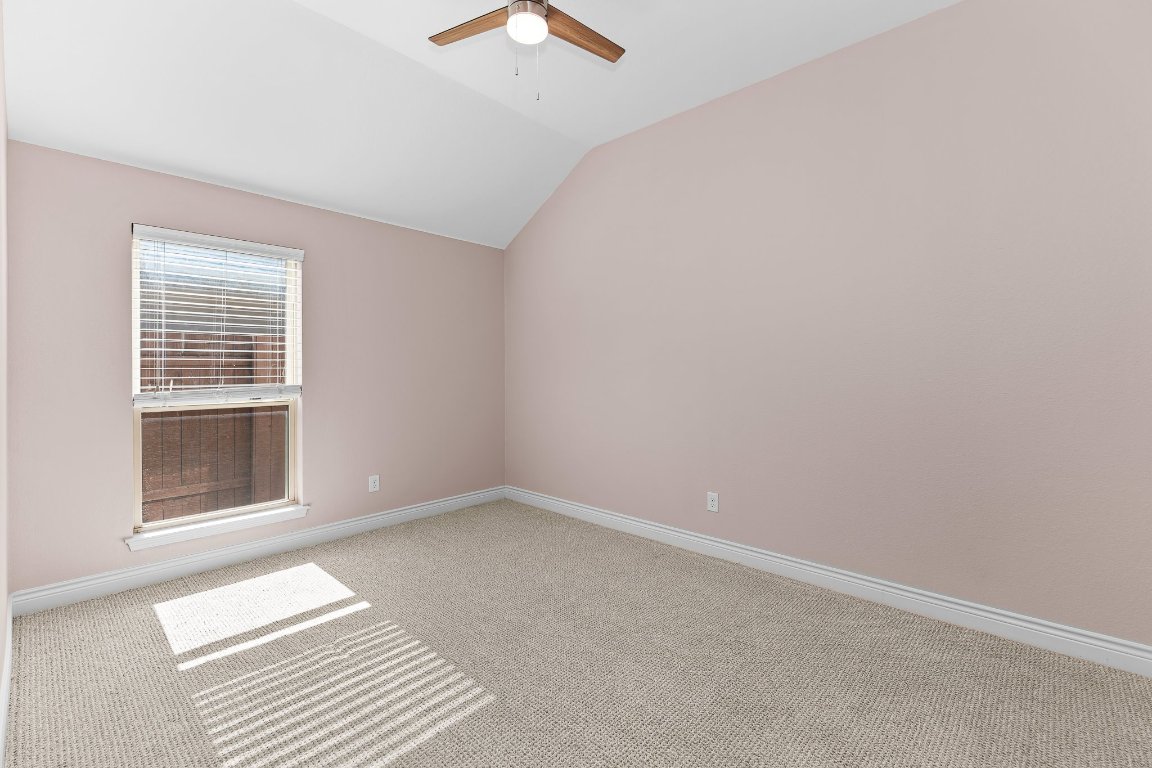 217 Serrano Street Georgetown, TX 78628 - Photo 18 of 27 a view of an empty room with a window