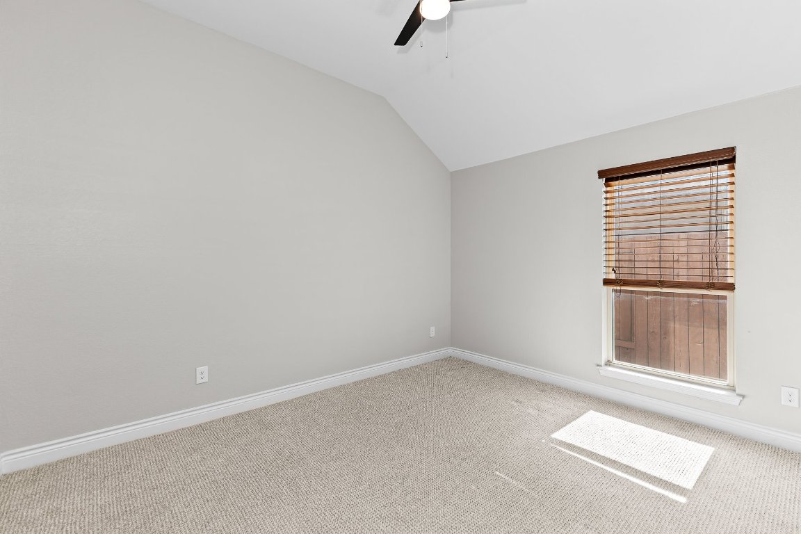 217 Serrano Street Georgetown, TX 78628 - Photo 20 of 27 an empty room with windows