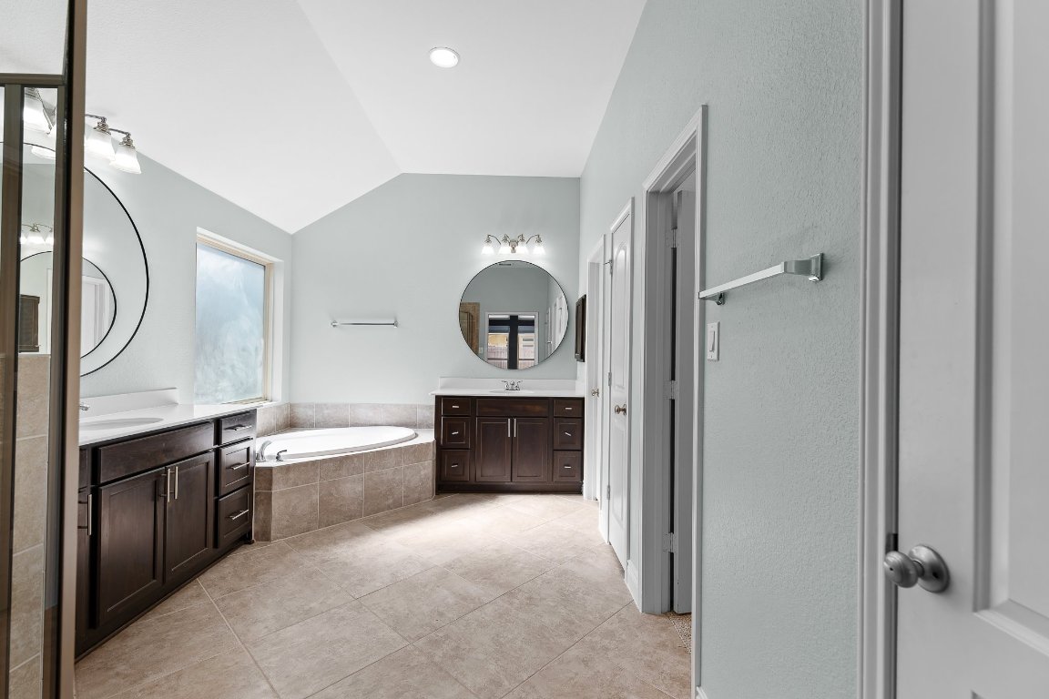 217 Serrano Street Georgetown, TX 78628 - Photo 23 of 27 a view of a kitchen from a corridor