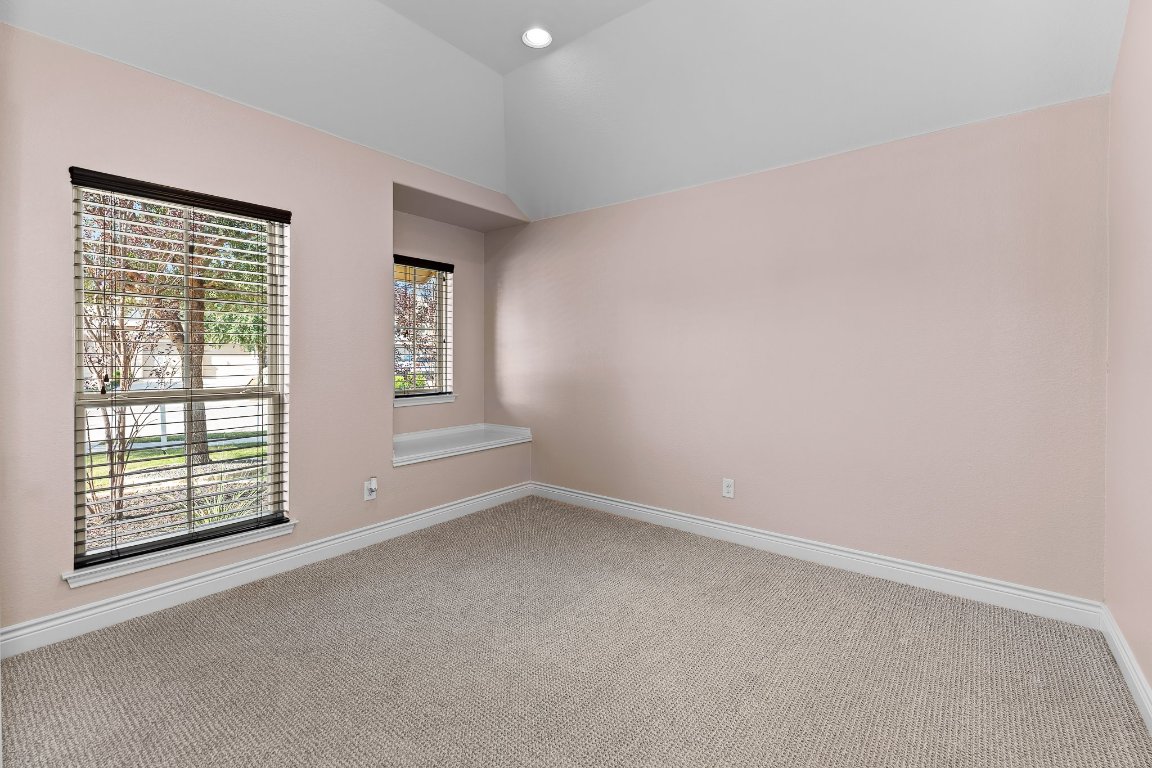 217 Serrano Street Georgetown, TX 78628 - Photo 4 of 27 an empty room with windows