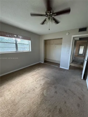 a view of an empty room with a window
