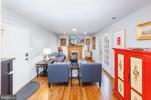 a view of a living room kitchen and a wooden floor
